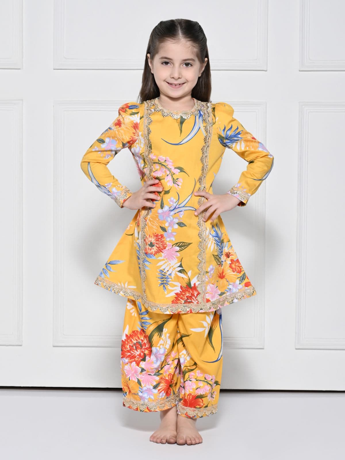 A YELLOW COTTON SUIT WITH A FLORAL PRINT FOR GIRLS A YELLOW COTTON SUIT WITH A FLORAL PRINT FOR GIRLS